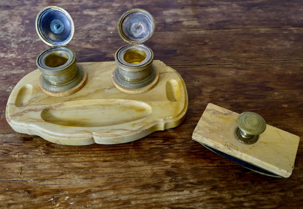 A French veined marble inkstand featuring two turned brass inkpots and a matching rectangular marble rocker blotter set on a shaped base. View V