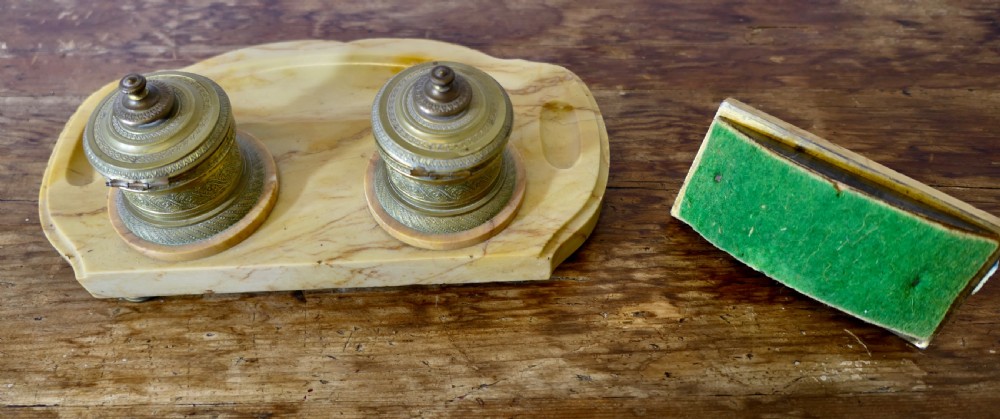A French veined marble inkstand featuring two turned brass inkpots and a matching rectangular marble rocker blotter set on a shaped base. View VII