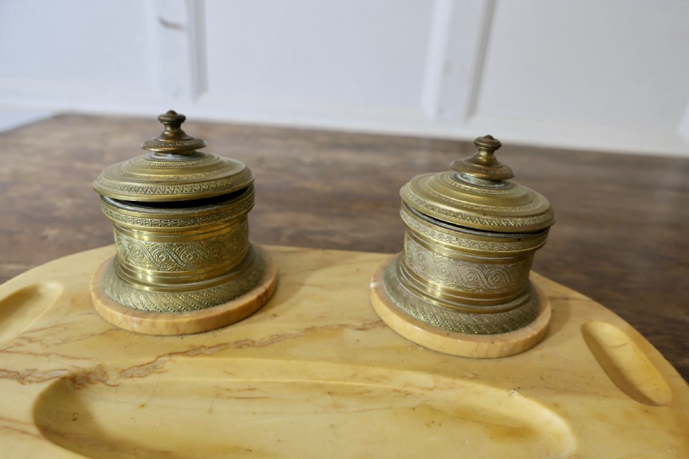 A French veined marble inkstand featuring two turned brass inkpots and a matching rectangular marble rocker blotter set on a shaped base. View VIII