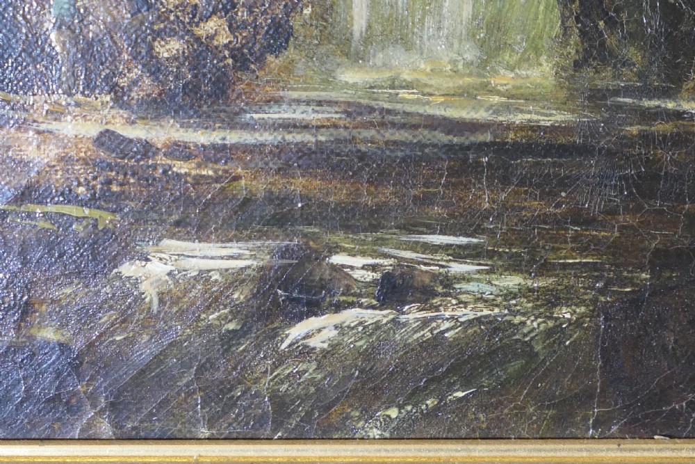 An antique Victorian oil painting depicting a cascading waterfall in a mountainous landscape, framed within an ornate gilded frame. View VI