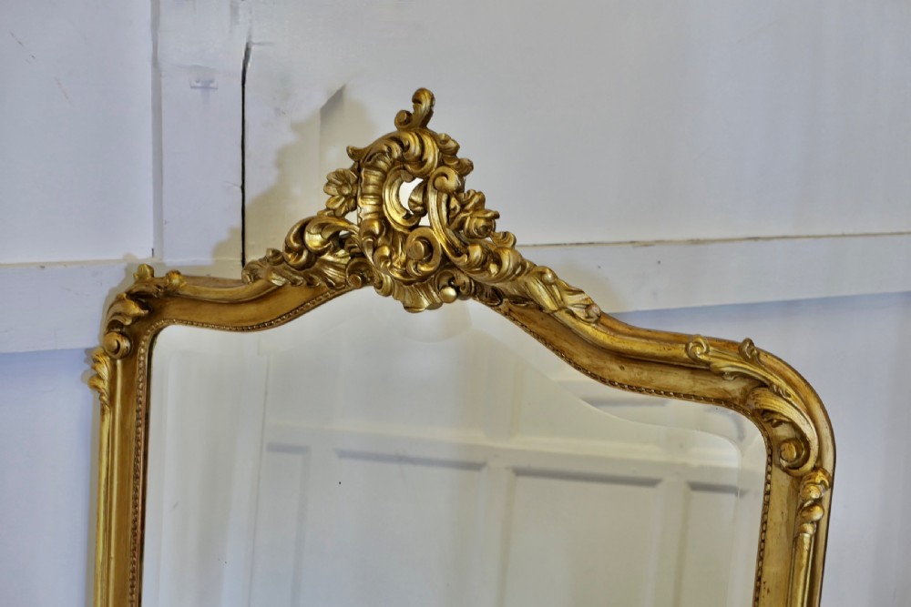 A Large Elaborate French Rococo Gilt Console Mirror Decorated with Leaves and Scrolls  View VII