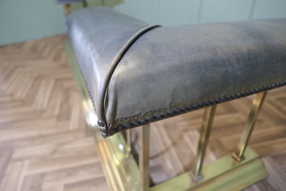 A Large Brass and Leather Club Fender View V