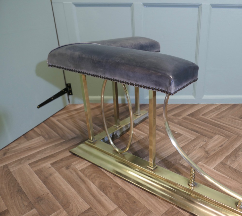 A Large Brass and Leather Club Fender View VI