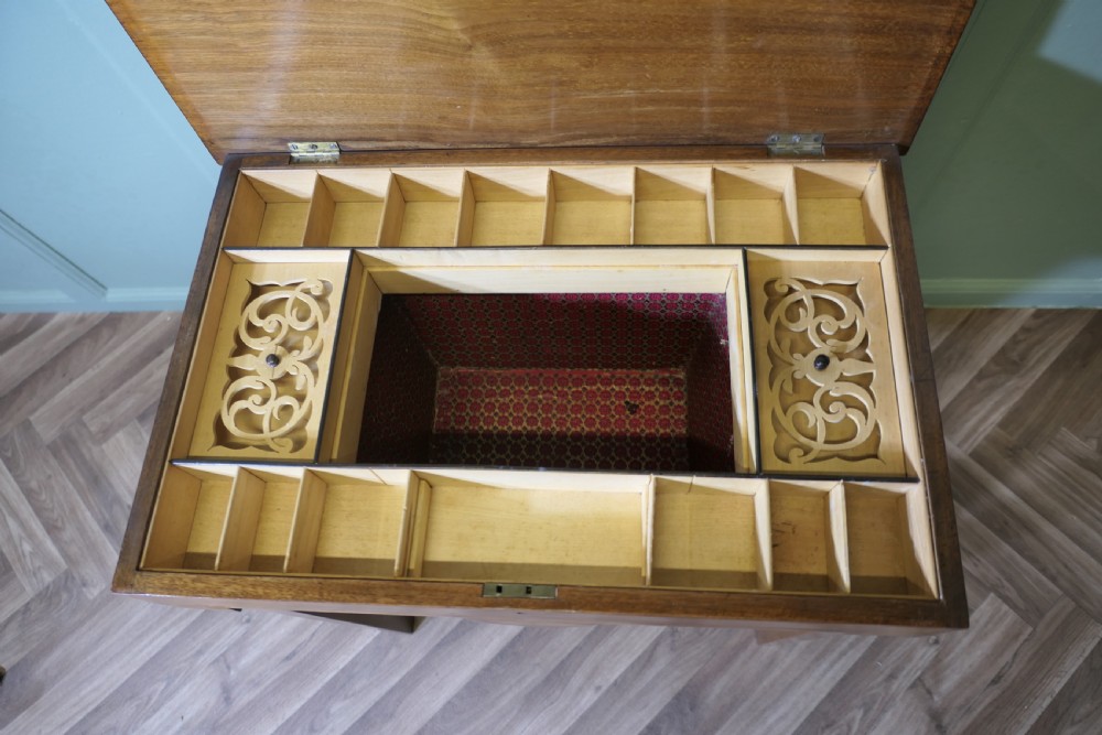 An Edwardian satin walnut sewing work table with tapered square legs, a fitted central drawer, and decorative fan marquetry inlay. View III