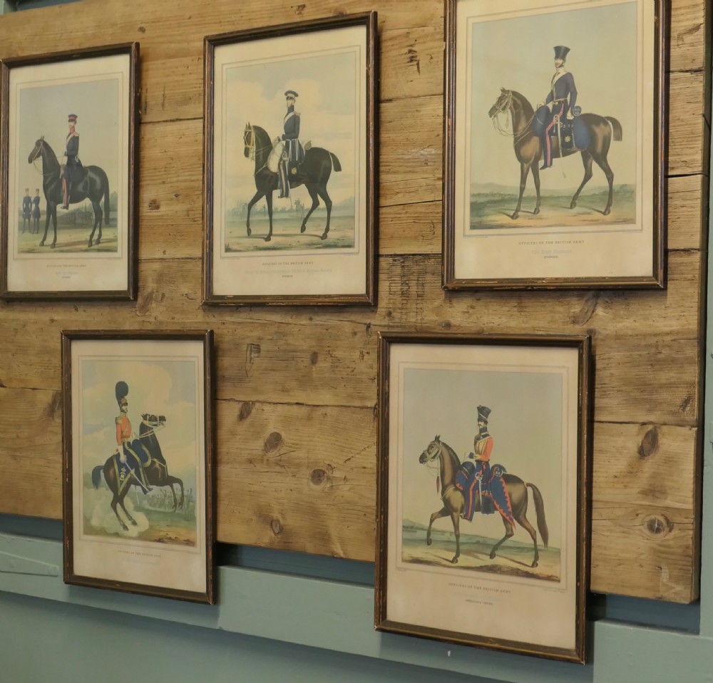 A set of five framed antique prints depicting British Army cavalry officers in uniform mounted on horses. View VI