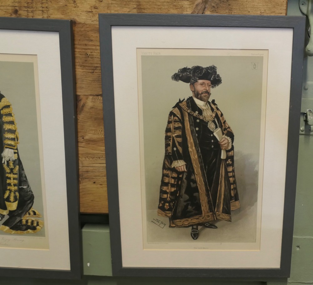 A collection of eight framed Vanity Fair caricature prints depicting Victorian and Edwardian figures displayed in matching dark frames. View III