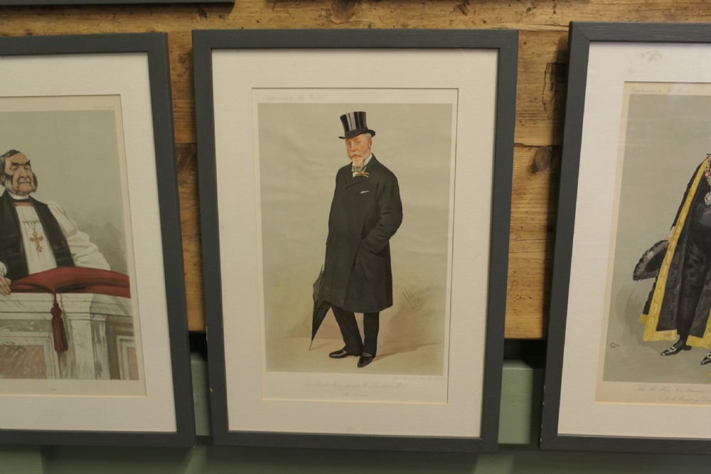A collection of eight framed Vanity Fair caricature prints depicting Victorian and Edwardian figures displayed in matching dark frames. View IX