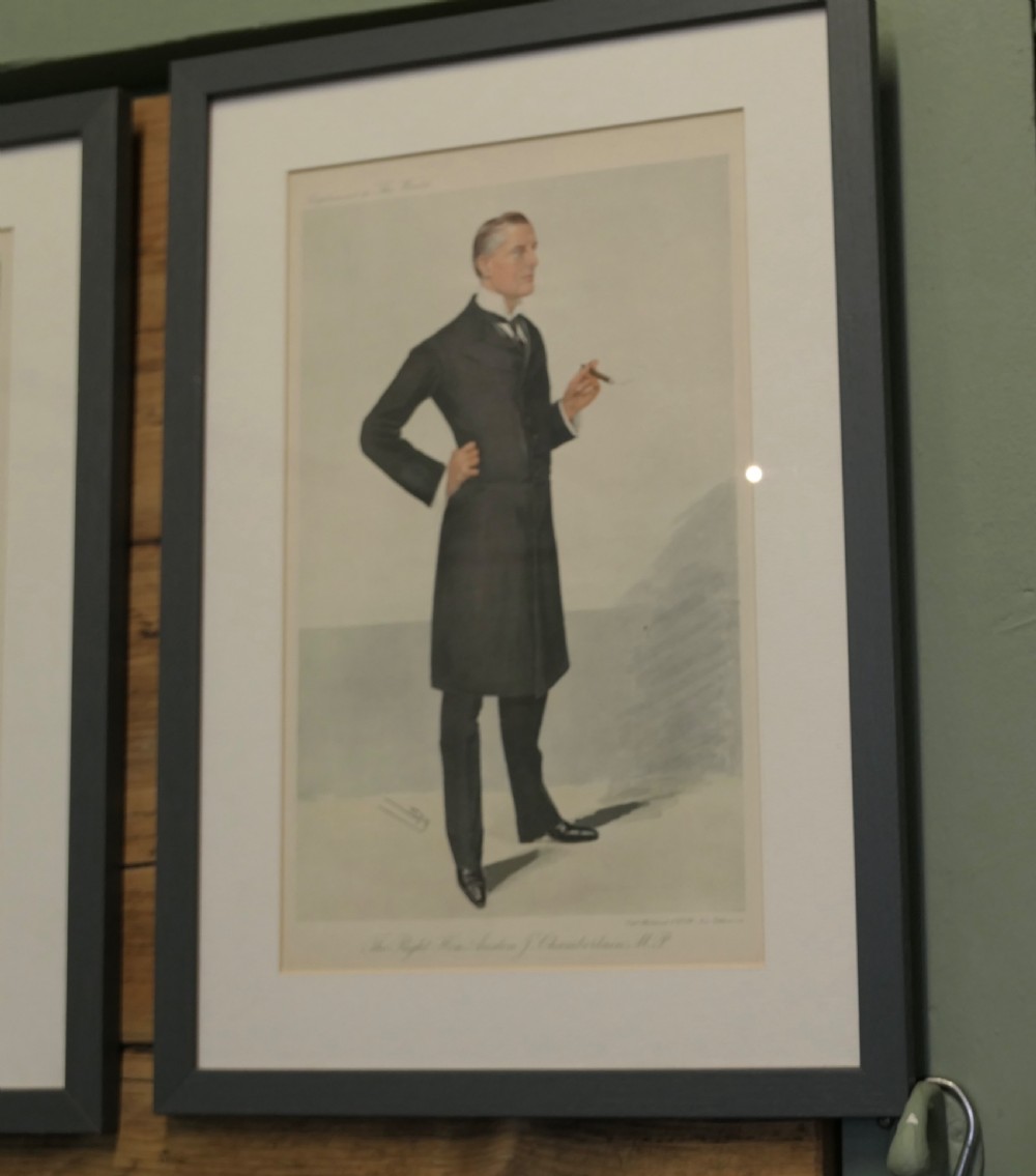 A collection of eight framed Vanity Fair caricature prints depicting Victorian and Edwardian figures displayed in matching dark frames. View XI