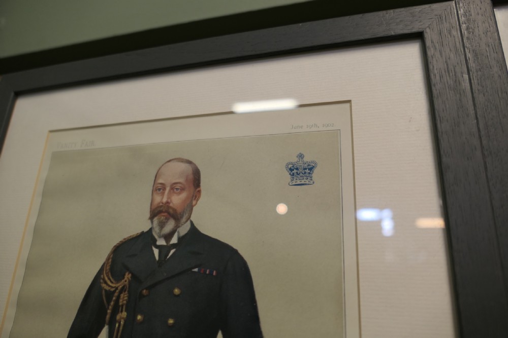 A collection of eight framed Vanity Fair caricature prints depicting Victorian and Edwardian figures displayed in matching dark frames. View XIII