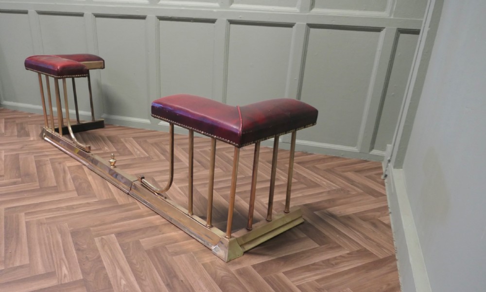 An Extending Brass and Leather Club Fender View VI