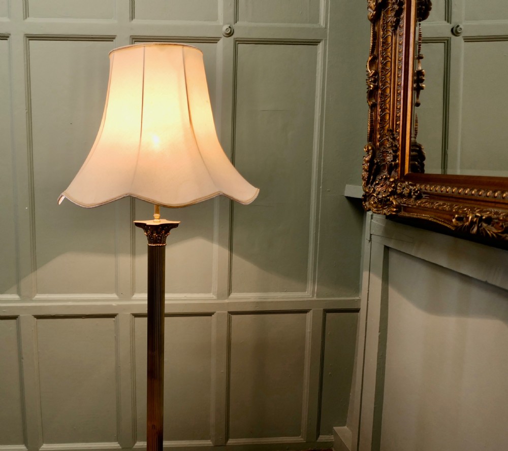 A Neoclassical brass column standard lamp featuring a fluted shaft, stepped plinth base with claw feet, and a pleated scalloped cream fabric shade. View II