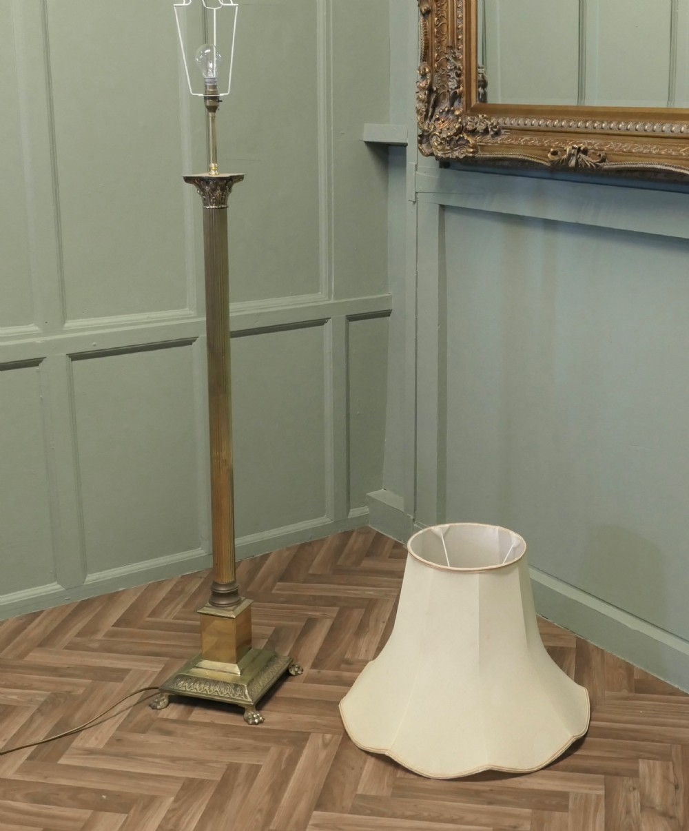 A Neoclassical brass column standard lamp featuring a fluted shaft, stepped plinth base with claw feet, and a pleated scalloped cream fabric shade. View V