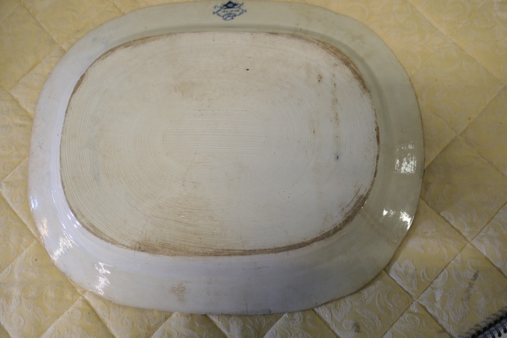 An oval Victorian ironstone meat platter featuring a cobalt blue Willow transferware pattern on a white glazed ceramic ground. View VIII