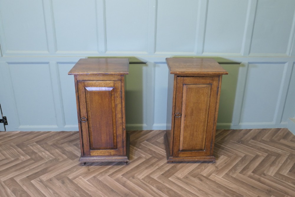 A Pair of Arts and Crafts Oak Bedside Cupboards