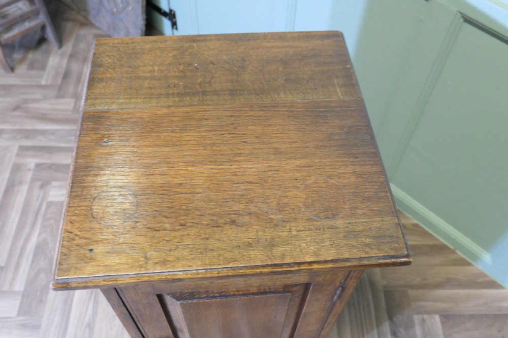 A Pair of Arts and Crafts Oak Bedside Cupboards View III