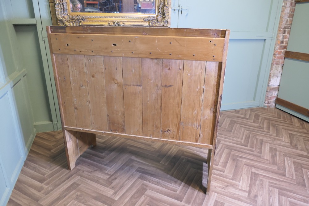A high-back rustic pine settle bench featuring vertical planking and solid side panels in a natural honey wood finish. View III