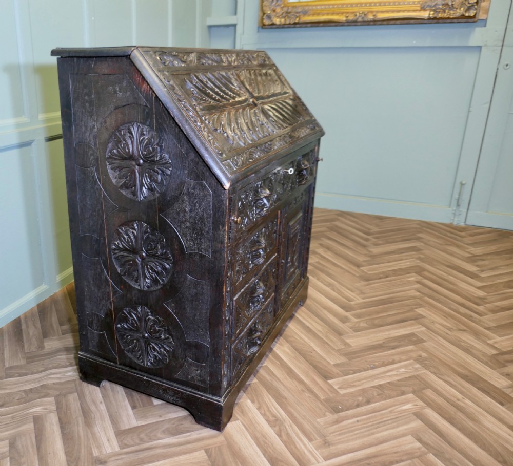 A Victorian Green Man Carved Oak Bureau 