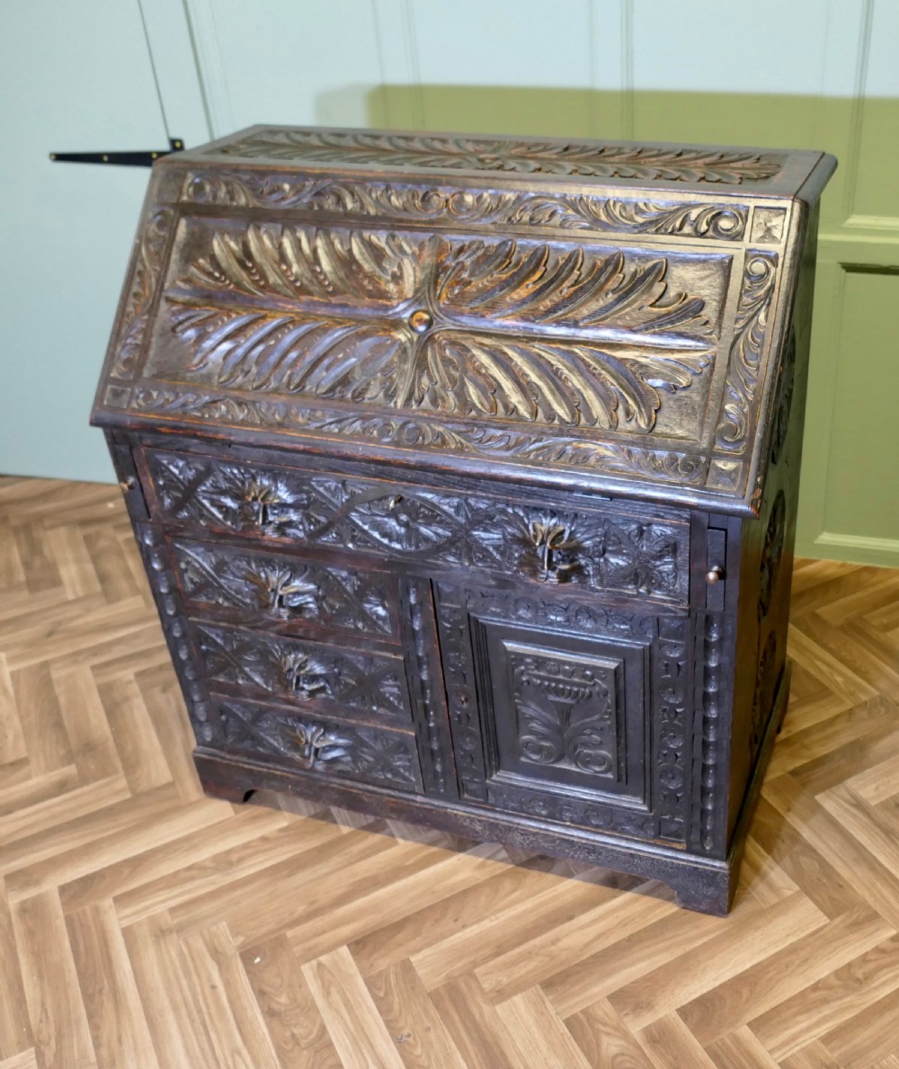A Victorian Green Man Carved Oak Bureau  View II