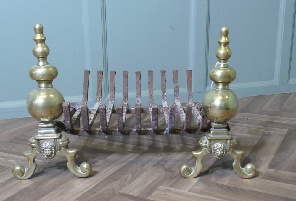 An Elegant Pair of Brass Andirons Complete with Grate 