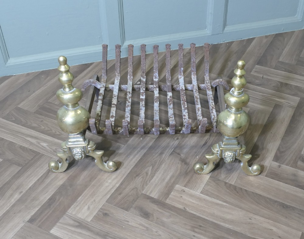 An Elegant Pair of Brass Andirons Complete with Grate  View II