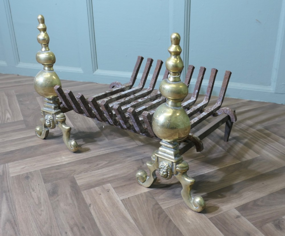 An Elegant Pair of Brass Andirons Complete with Grate  View IV
