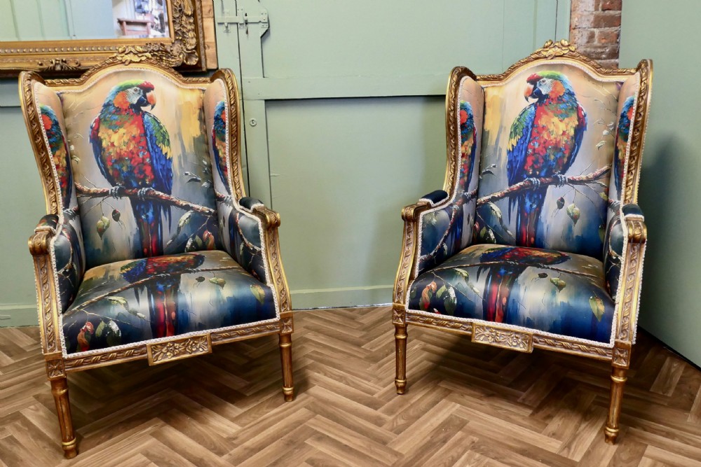 A Pair of Salon Chairs with Silk Parrot Design