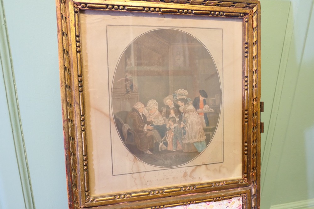 A four-panel French folding screen featuring gilded wood frames, glazed mirror panes at the top, and upholstered fabric lower sections. View VI