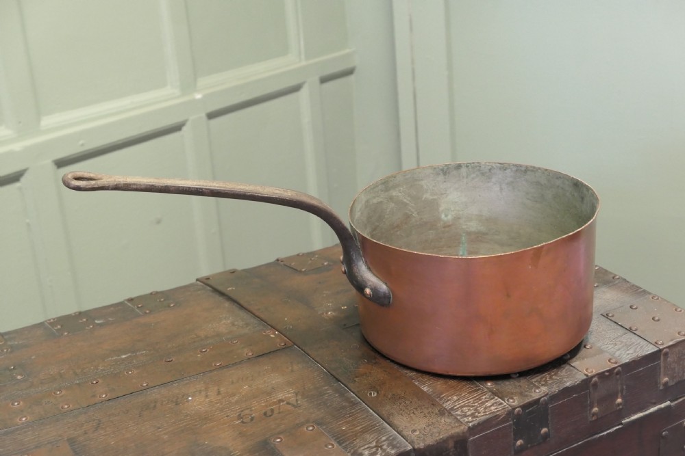 A large 19th-century French copper pot featuring a long iron handle secured with rivets and a tin-lined interior. View III