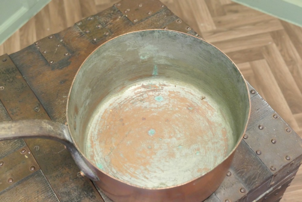 A large 19th-century French copper pot featuring a long iron handle secured with rivets and a tin-lined interior. View IV