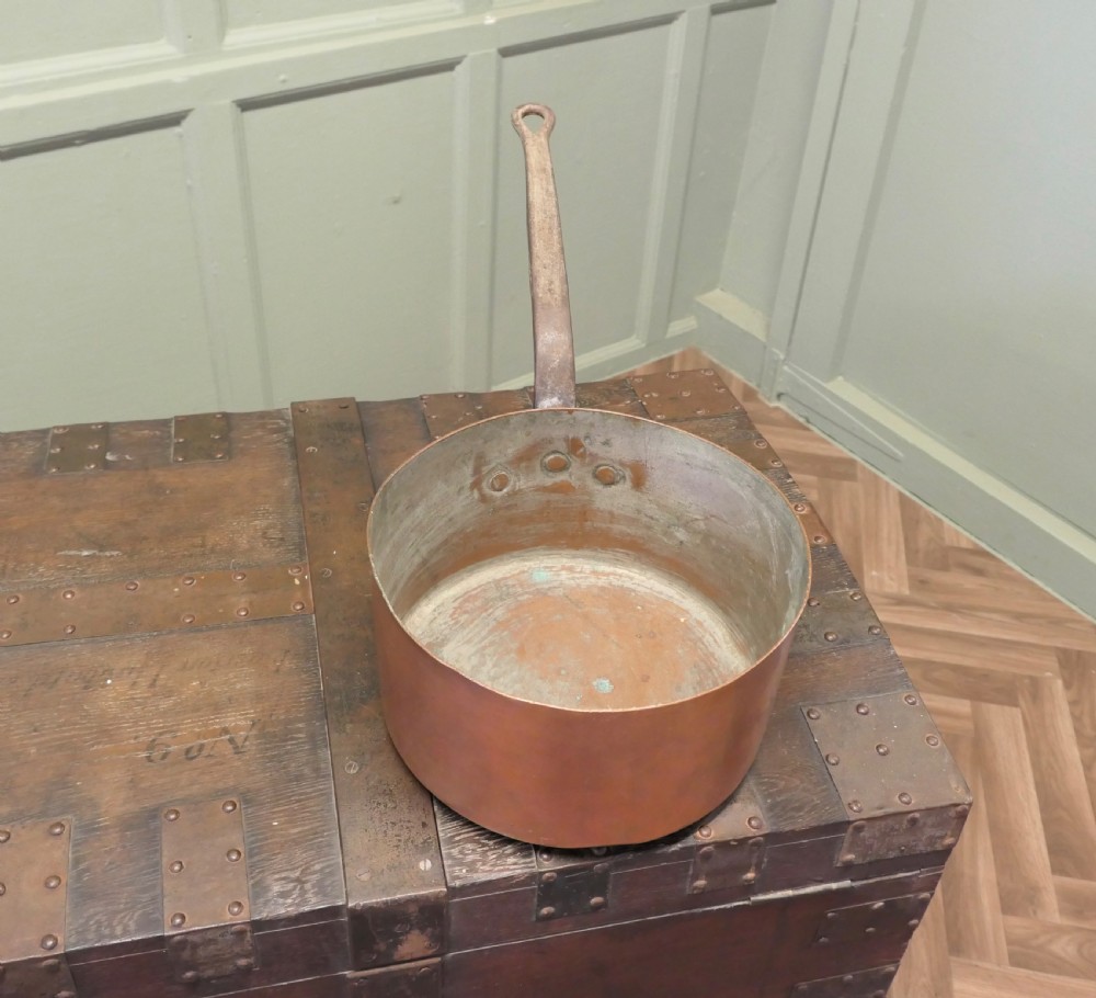 A large 19th-century French copper pot featuring a long iron handle secured with rivets and a tin-lined interior. View V