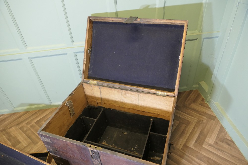 A 19th-century dark oak silver chest reinforced with riveted iron bands, corner brackets, side handles, and a front iron latch. View III
