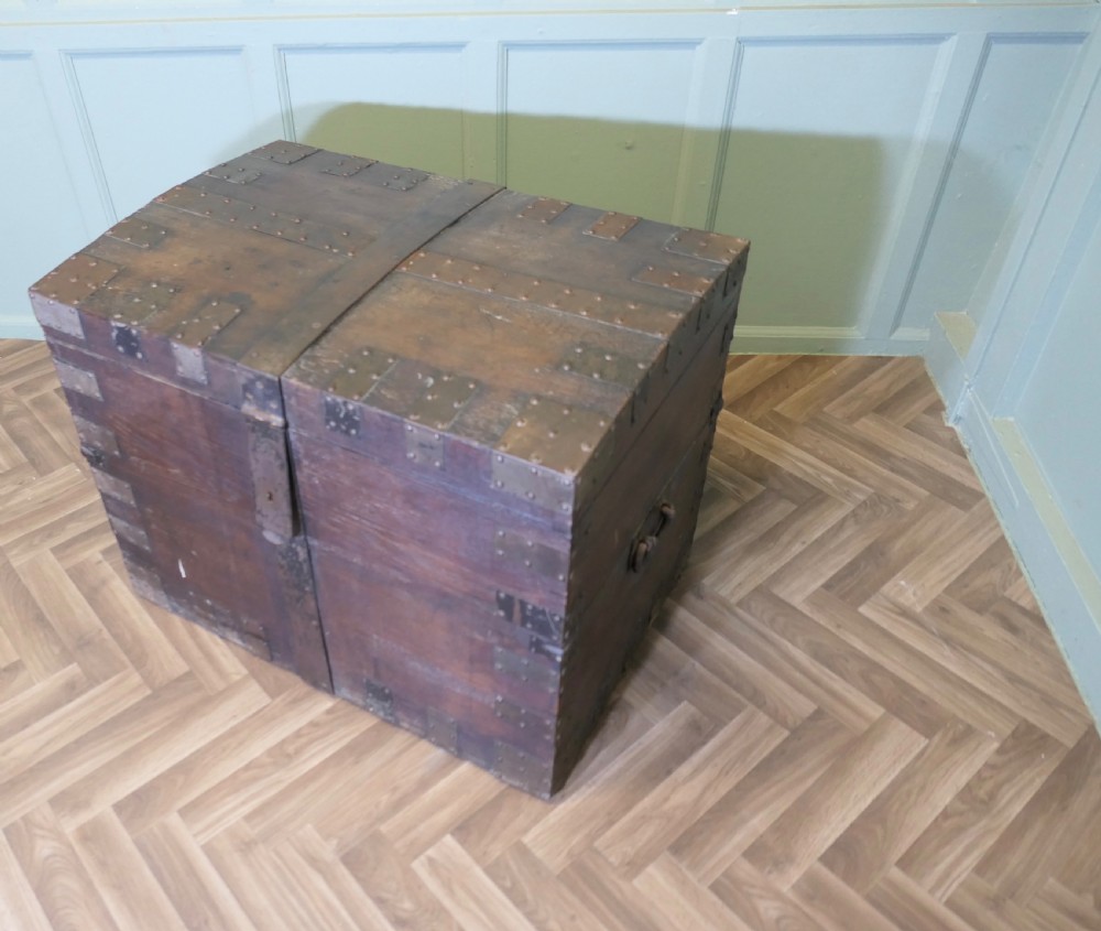 A 19th-century dark oak silver chest reinforced with riveted iron bands, corner brackets, side handles, and a front iron latch. View V