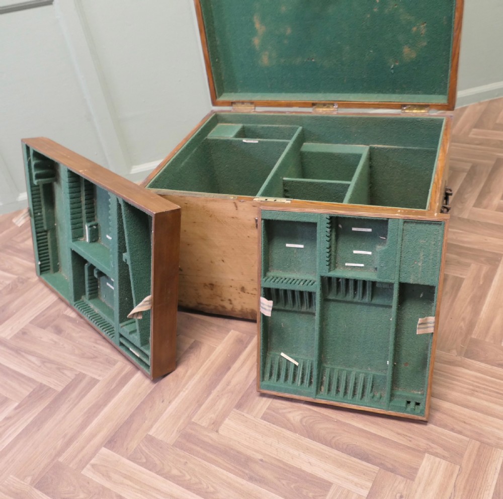A rectangular golden oak travelling silver chest featuring a hinged lid and central iron locking latch. View VI