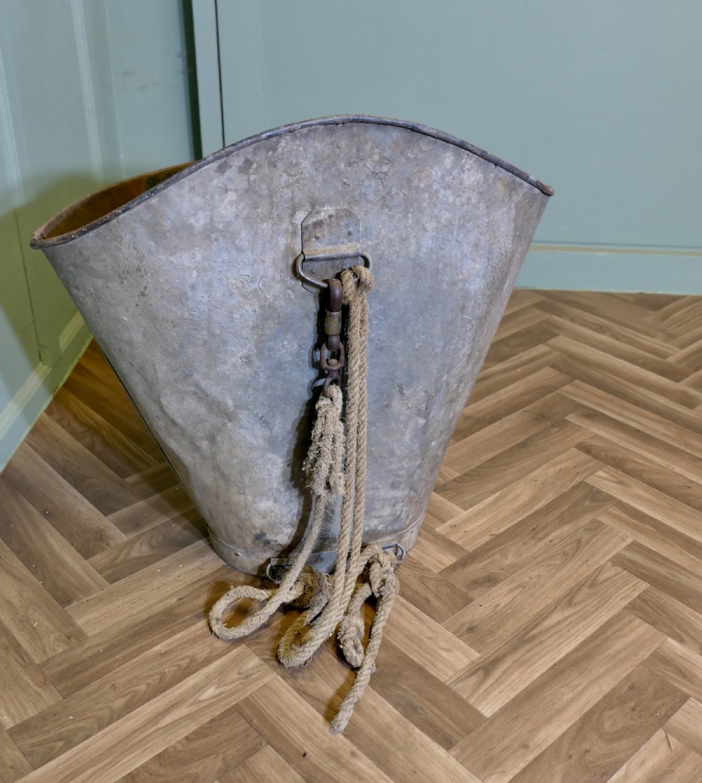 A nineteenth-century tapered French galvanised metal grape hod with attached hemp ropes and a weathered grey patinated surface.