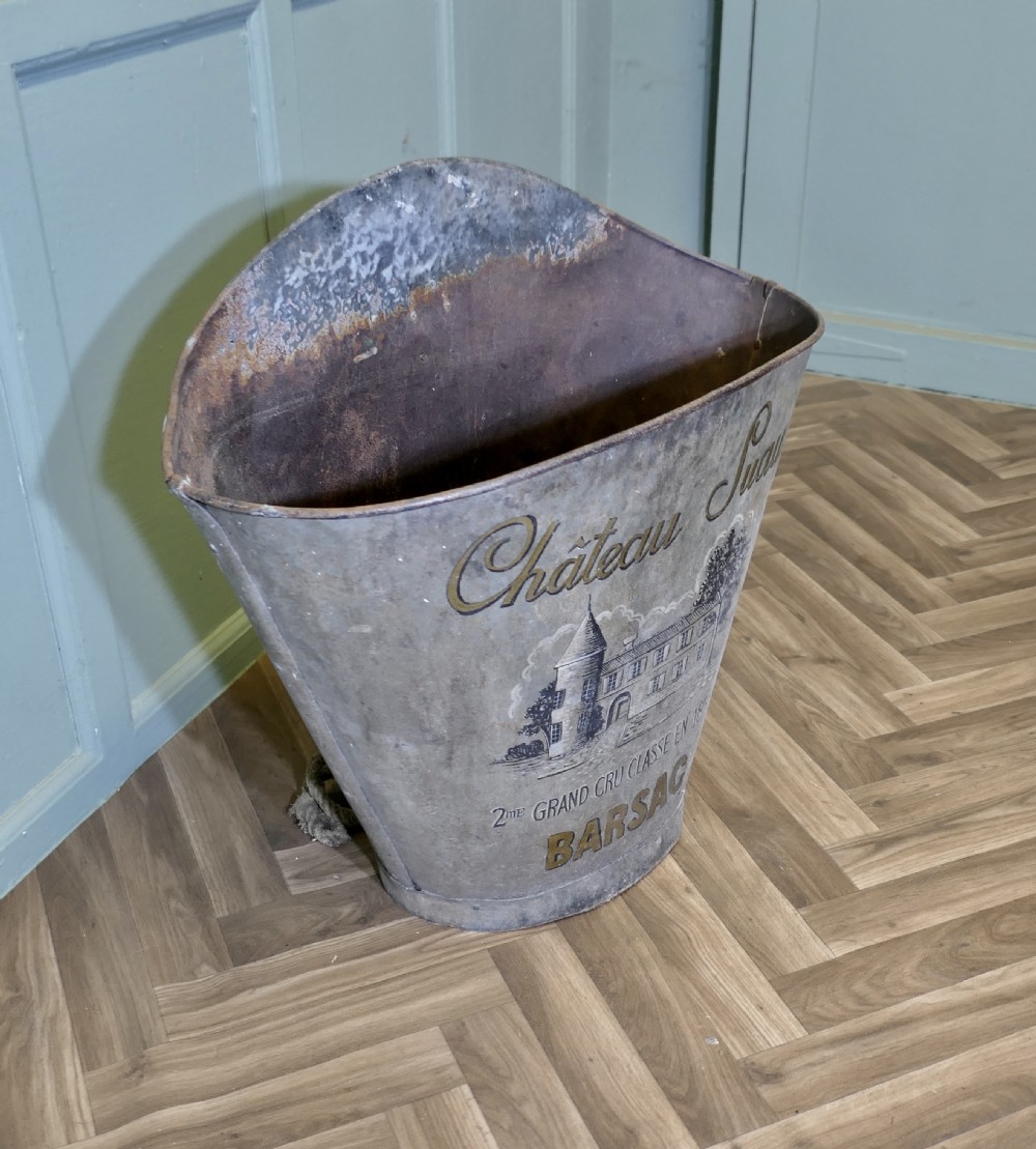 A nineteenth-century tapered French galvanised metal grape hod with attached hemp ropes and a weathered grey patinated surface. View II