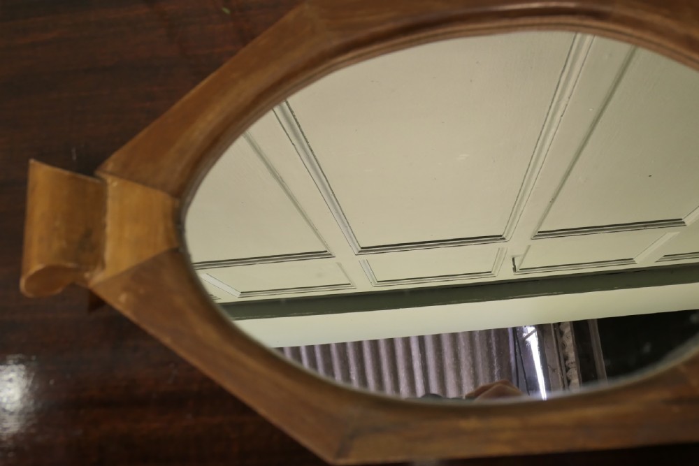An octagonal wooden Art Deco mirror tray featuring carved scroll side handles and a central glass insert. View III