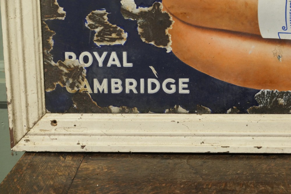 A framed early twentieth-century blue vitreous enamel advertising sign with bold lettering for Palethorpes and a central illustration of packaged sausages. View III