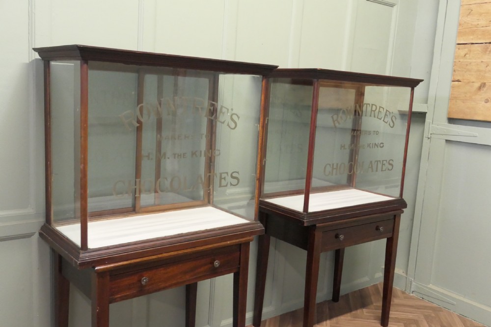 An Edwardian glazed mahogany shop display cabinet featuring gilded Rowntrees Chocolates lettering on the front glass panel. View II