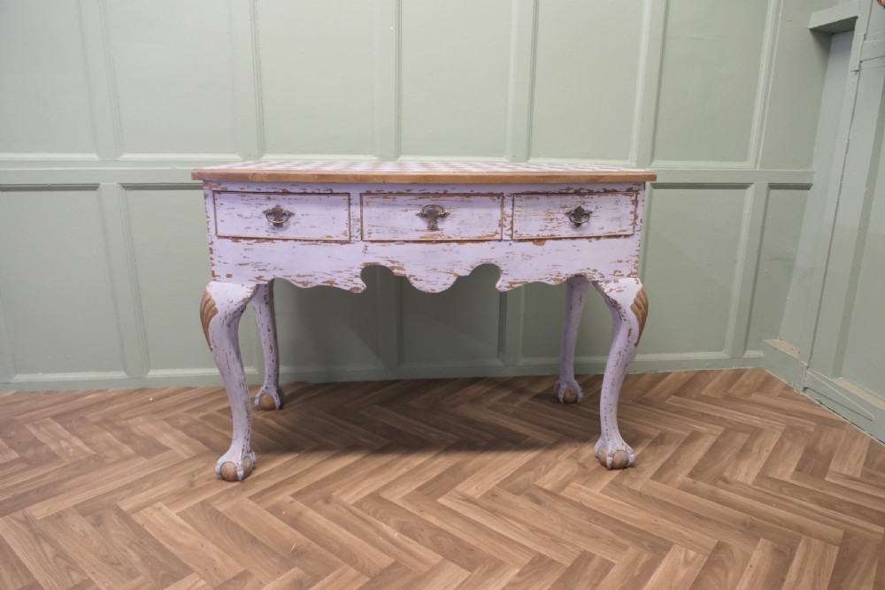 An eighteenth-century style painted bow-front console table featuring a diamond-pattern top, carved shell knees, claw-and-ball feet, and brass drawer handles. View III