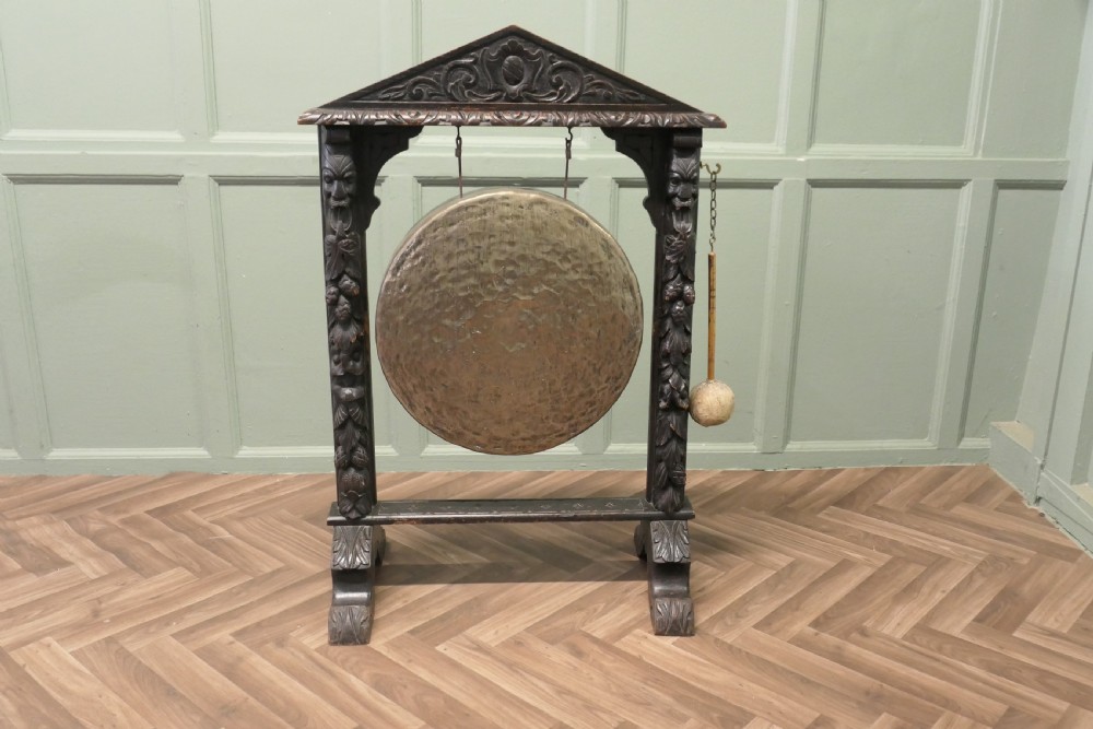A Large Gothic Carved Oak and Brass Dinner Gong