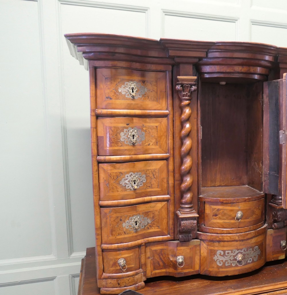 A Baroque burr walnut tabletop escritoire cabinet with a central revolving tabernacle flanked by barley-twist columns and small side drawers. View II
