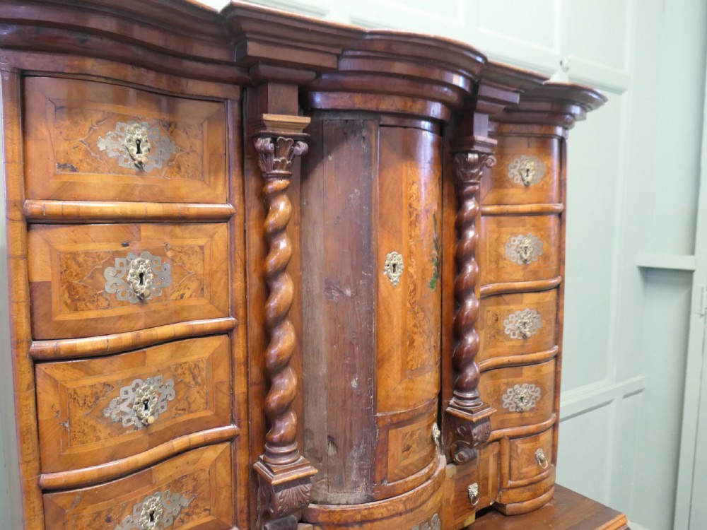 A Baroque burr walnut tabletop escritoire cabinet with a central revolving tabernacle flanked by barley-twist columns and small side drawers. View V
