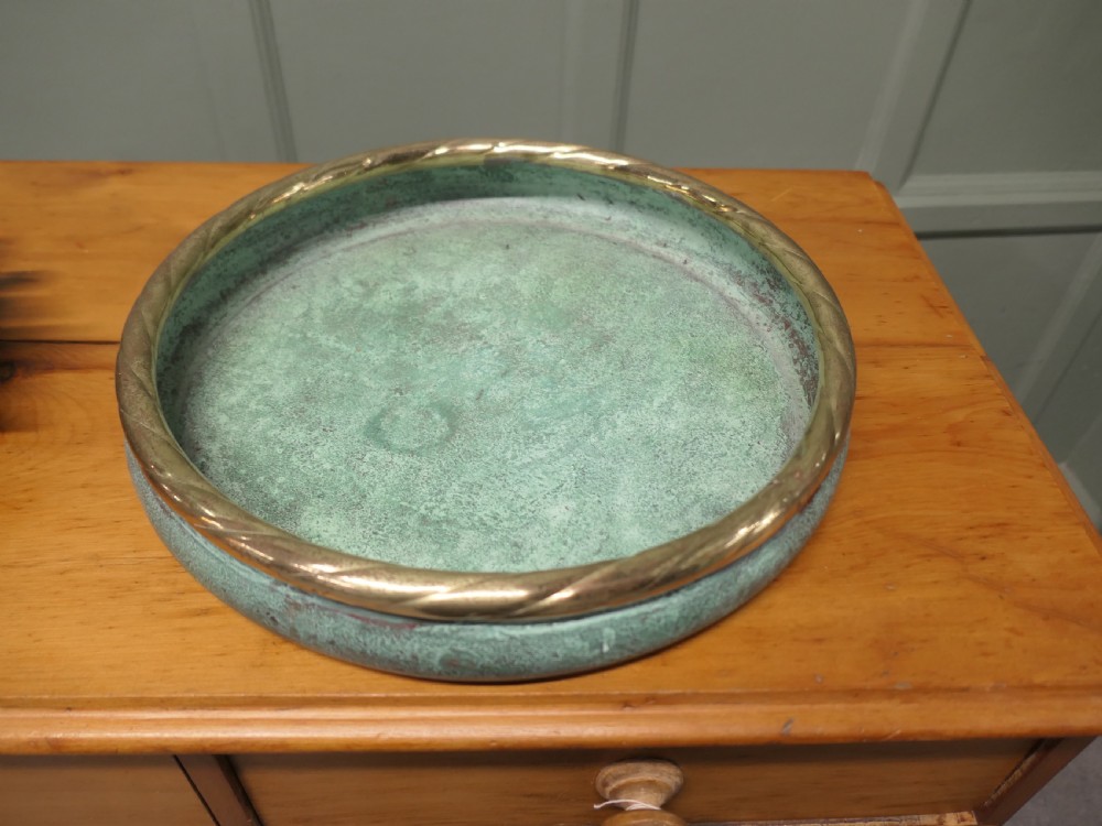 A round French copper rose bowl featuring a green verdigris finish and a polished brass rope-twist rim. View V