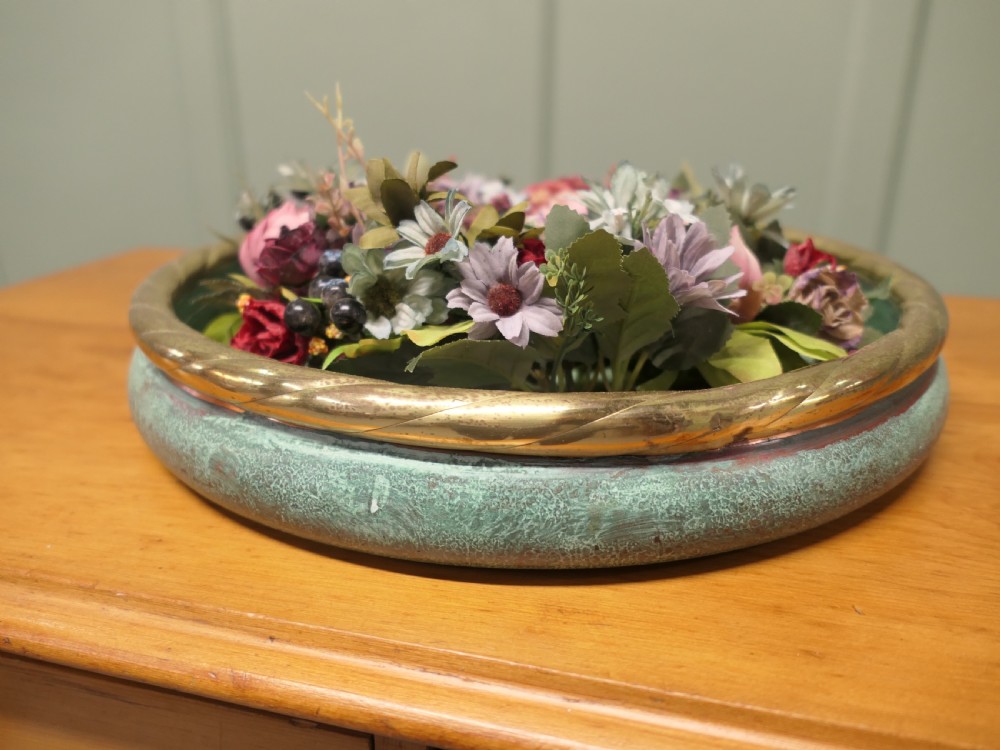 A round French copper rose bowl featuring a green verdigris finish and a polished brass rope-twist rim. View VI