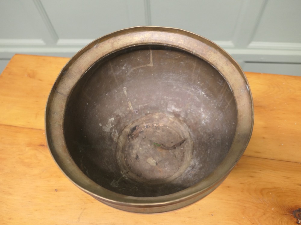 A nineteenth-century brass planter featuring a rounded bulbous body, narrow base, and flared rim with natural surface patination. View II