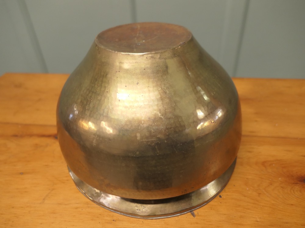 A nineteenth-century brass planter featuring a rounded bulbous body, narrow base, and flared rim with natural surface patination. View III