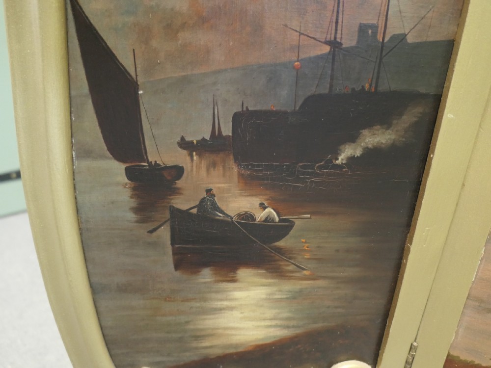 A three-panel folding fire screen with a carved gold giltwood frame and oil-painted maritime scenes depicting ships near a coastal shore at sunset. View VII