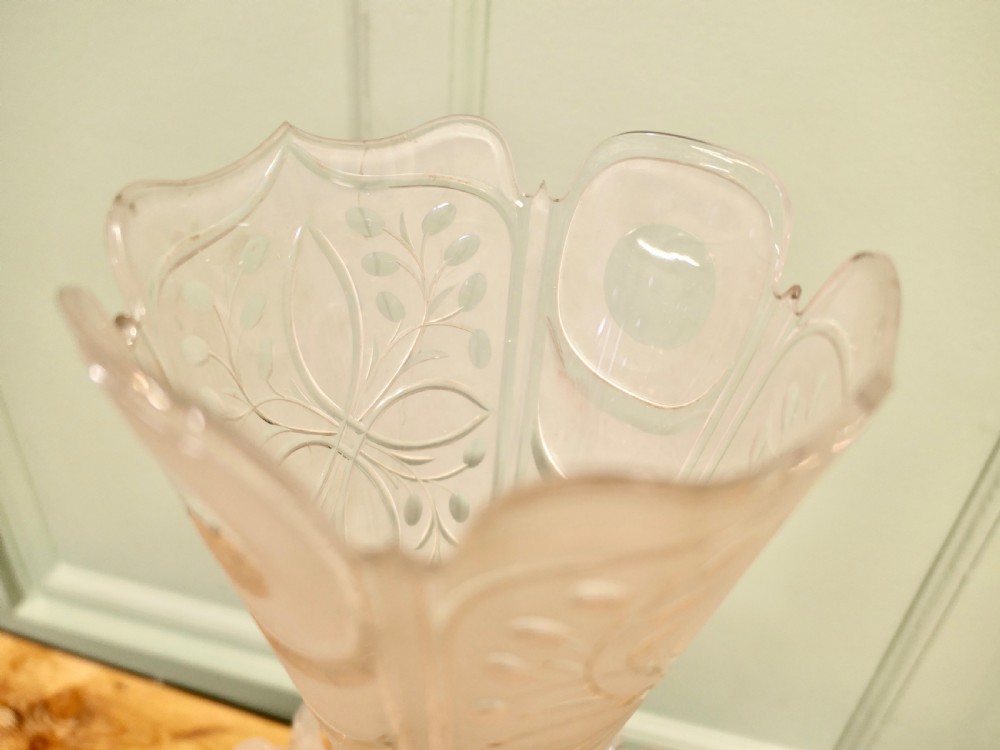 An epergne featuring a central frosted etched crystal trumpet vase and lower tray mounted on a hand-carved dark wood leaf base. View V