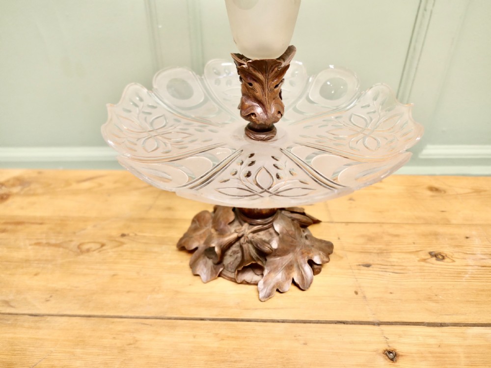 An epergne featuring a central frosted etched crystal trumpet vase and lower tray mounted on a hand-carved dark wood leaf base. View VI