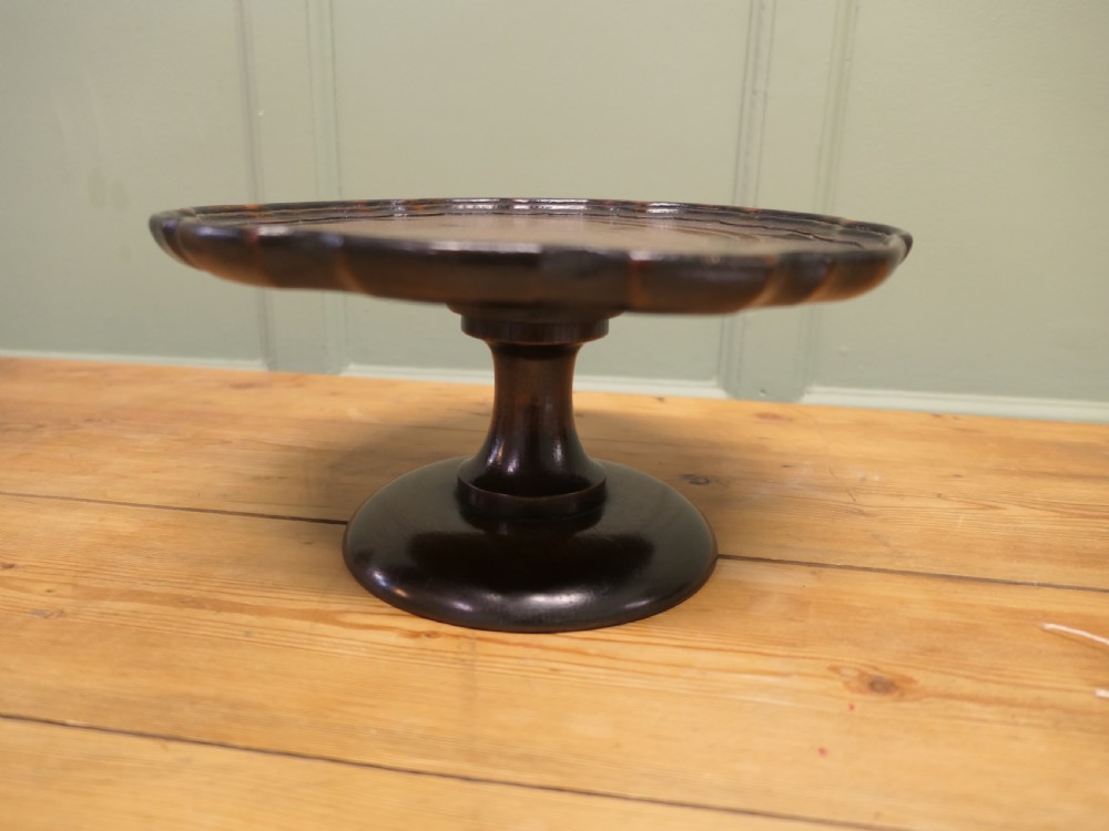 A dark oak Art Deco tazza featuring a scalloped circular tray top supported by a turned pedestal base. View III